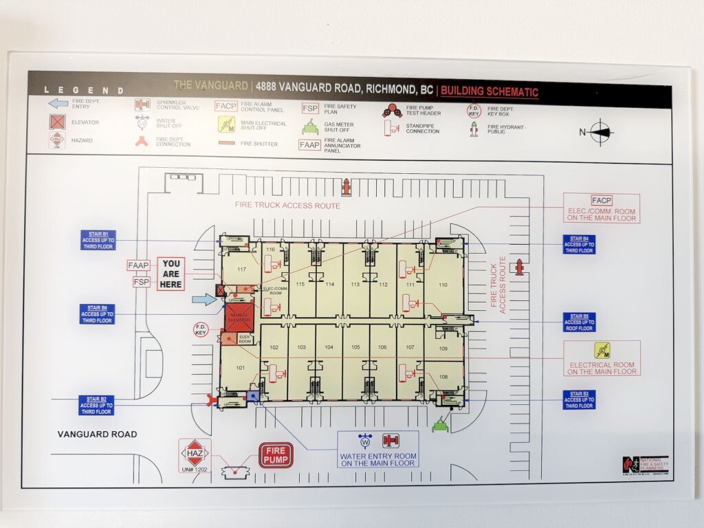 For Sale: Industrial Units in Richmond (Near Shell Rd & Alderbridge) 列治文工業地鋪出售 | Selling & Managing Vancouver Real Estate Building schematic for The Vanguard at 4888 Vanguard Road, Richmond BC, showing floor plan, exits, stairs, elevator and fire safety icons.