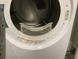 Bottom lint trap lifted open inside the dryer door