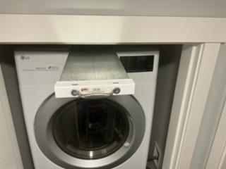 Top lint trap pulled out from above the dryer